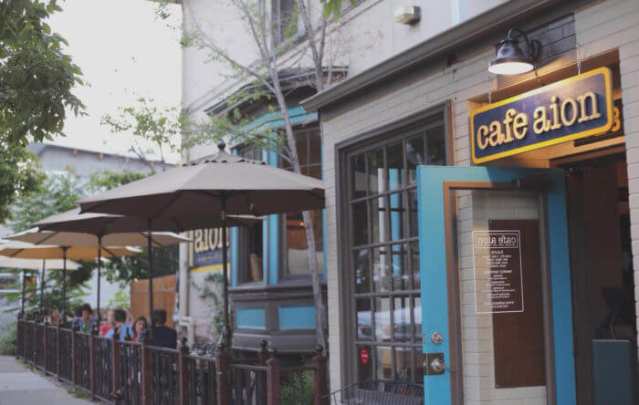 Entrance to cozy cafe with blue door.