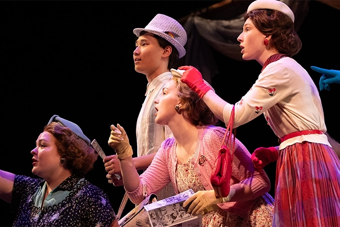 Actors in vintage clothes on stage